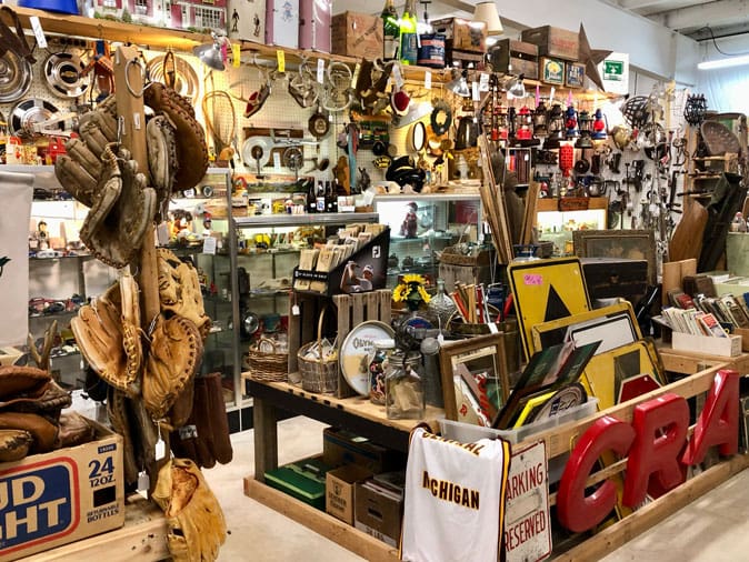 Vintage records, old signs, baseball gloves, and collectibles inside West Michigan Antique Mall
