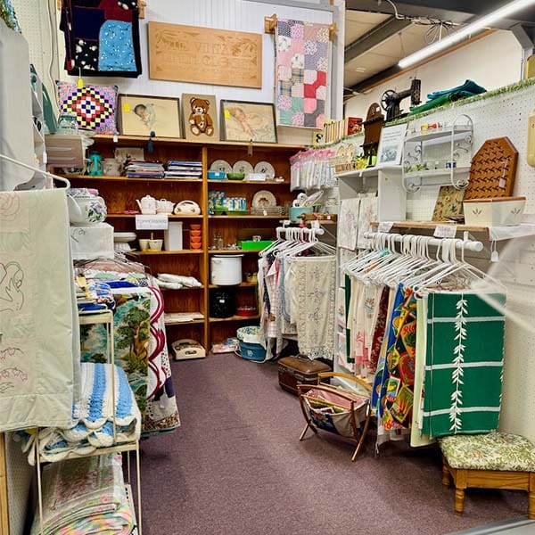 Vintage linens and textiles displayed by a local dealer